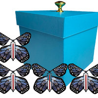 Blue Exploding Butterfly Gift Box With 4 Stardust Monarch Wind Up Flying Butterflies from butterflyers.com