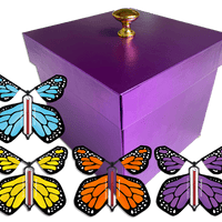 Purple Exploding Butterfly Gift Box With 4 Multi Color Monarch Wind Up Flying Butterflies from butterflyers.com
