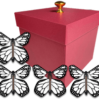 Red Exploding Butterfly Gift Box With 4 White Monarch Wind Up Flying Butterflies from butterflyers.com