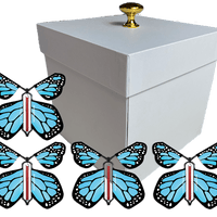 White Exploding Butterfly Gift Box With 4 Blue Monarch Wind Up Flying Butterflies from butterflyers.com