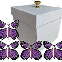 White Exploding Butterfly Gift Box With 4 Purple Monarch Wind Up Flying Butterflies from butterflyers.com