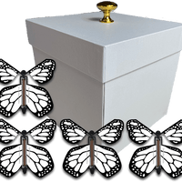 White Exploding Butterfly Gift Box With 4 White Monarch Wind Up Flying Butterflies from butterflyers.com