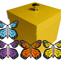 Yellow Exploding Butterfly Gift Box With 4 Multi Color Monarch Wind Up Flying Butterflies from butterflyers.com